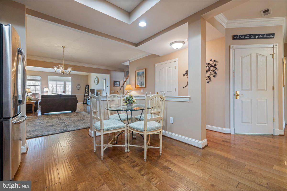 327 Melbourne Way Souderton, PA 18964 - Photo 14 of 44 a dining room with furniture and wooden floor