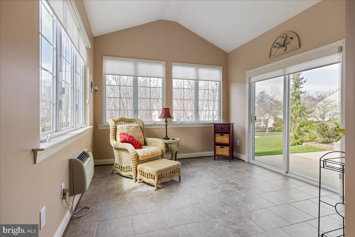 327 Melbourne Way Souderton, PA 18964 - Photo 16 of 44 a living room filled with furniture and a floor to ceiling window