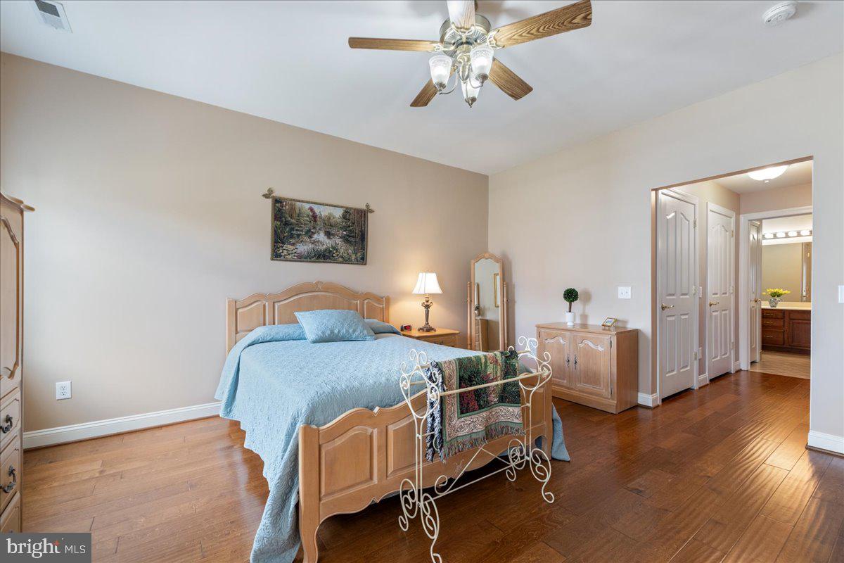 327 Melbourne Way Souderton, PA 18964 - Photo 19 of 44 a bedroom with furniture and wooden floor