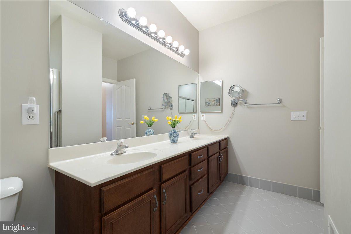 327 Melbourne Way Souderton, PA 18964 - Photo 21 of 44 a bathroom with a sink and a mirror