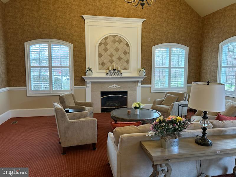 327 Melbourne Way Souderton, PA 18964 - Photo 39 of 44 a living room with furniture and a fireplace