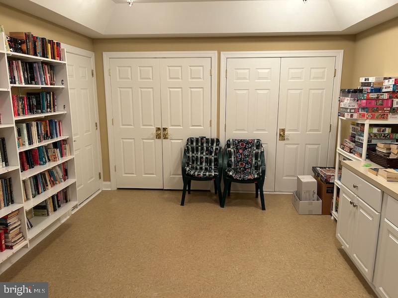 327 Melbourne Way Souderton, PA 18964 - Photo 44 of 44 a living room with furniture and a book shelf