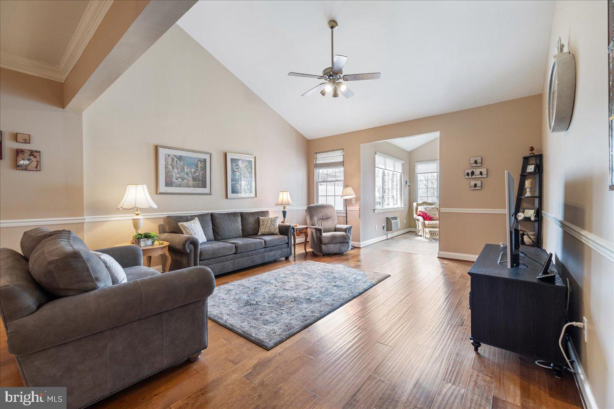 327 Melbourne Way Souderton, PA 18964 - Photo 6 of 44 a living room with furniture and a wooden floor
