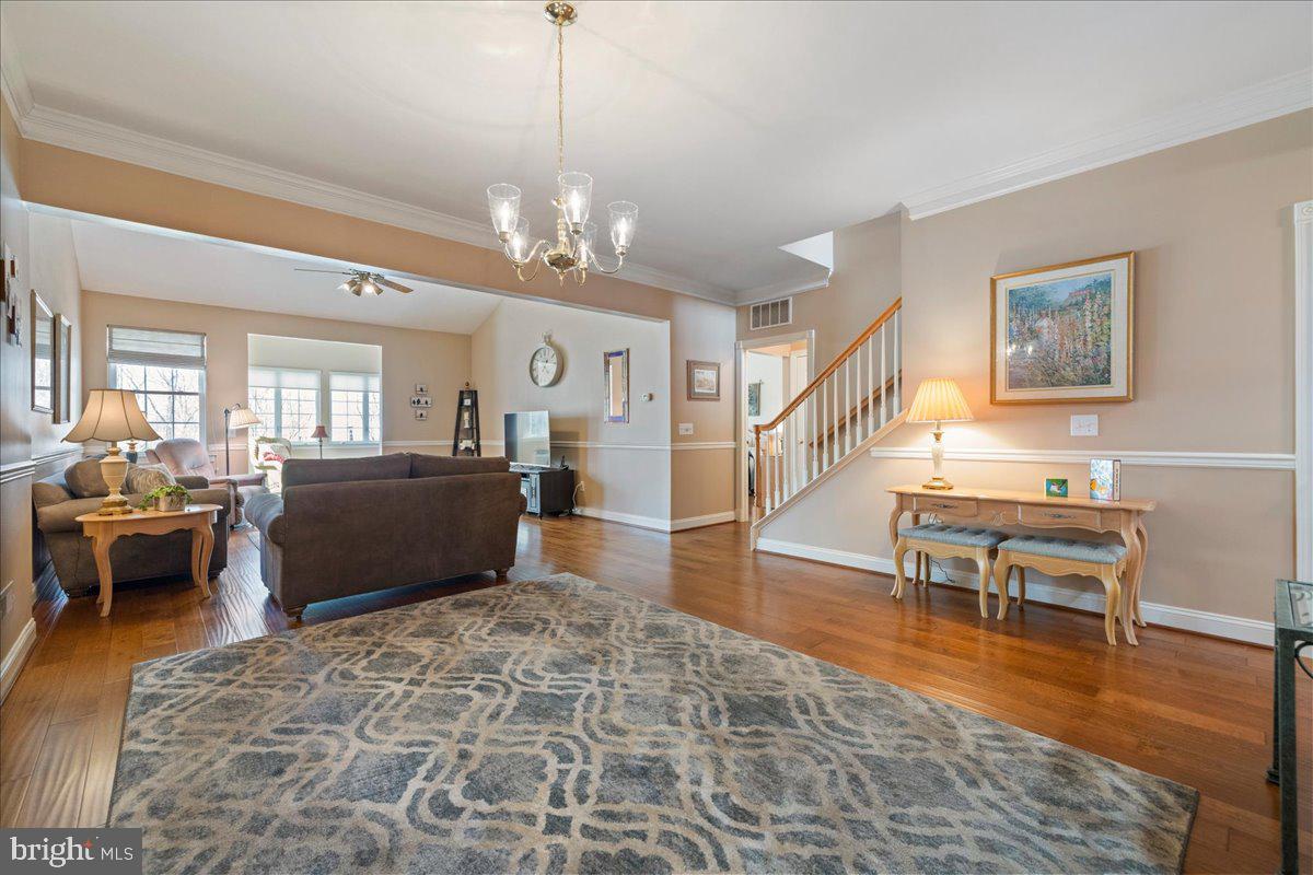 327 Melbourne Way Souderton, PA 18964 - Photo 10 of 44 a living room with furniture and a chandelier