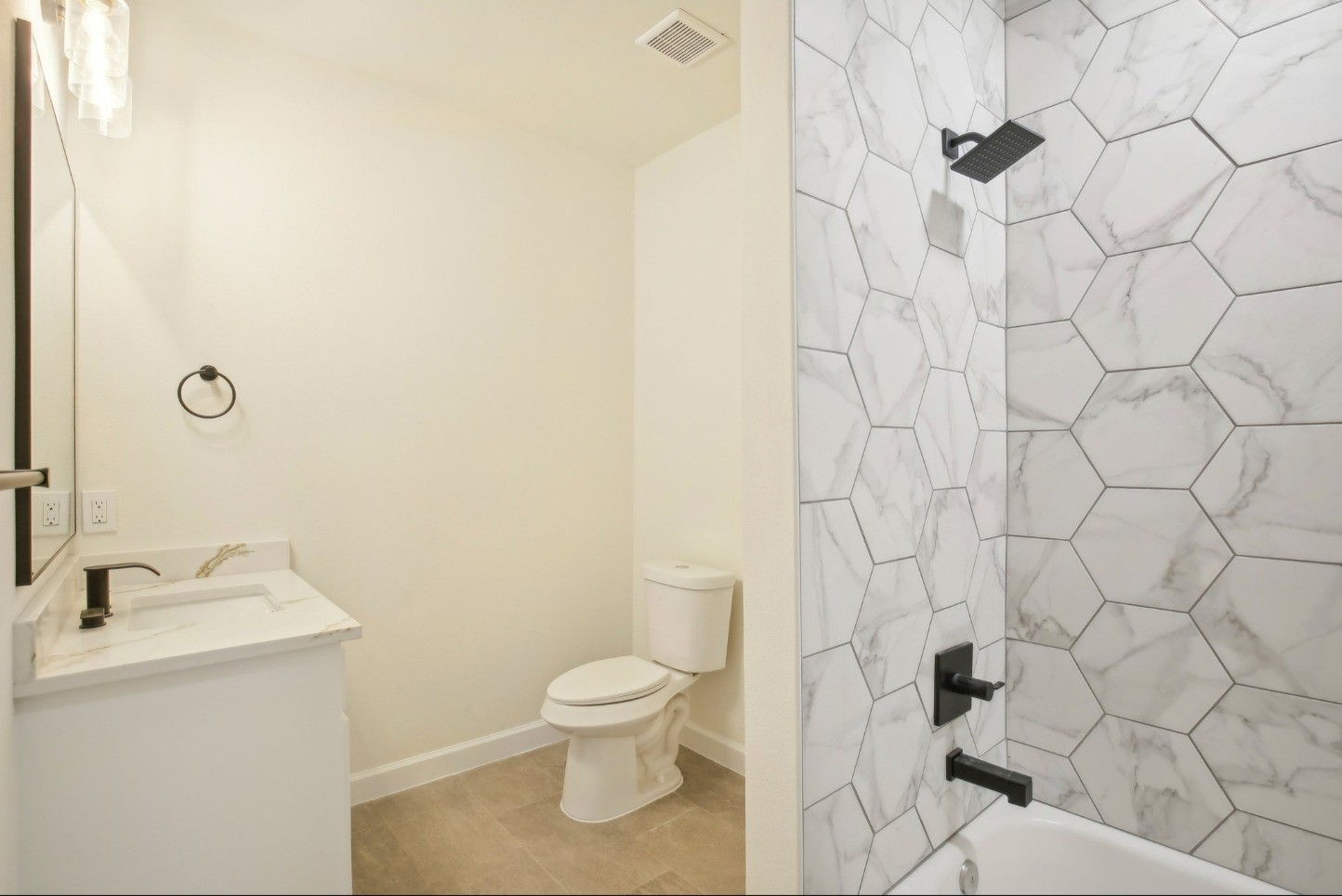 108 West 10th 1/2 Street Houston, TX 77008 - Photo 15 of 18 a white toilet sitting next to a white sink