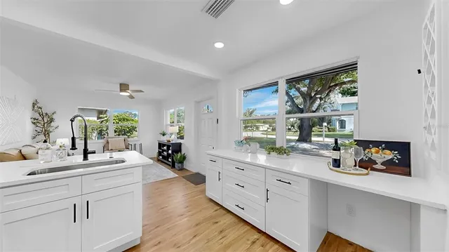 a kitchen with sink and window