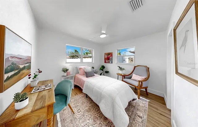 a bed room with a bed and a chair