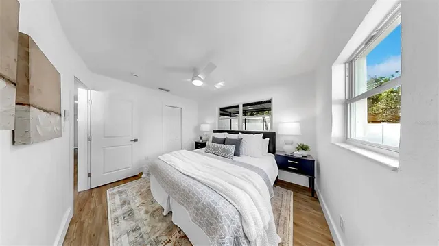 a bedroom with a bed and a window