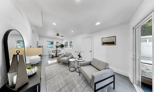 a living room with furniture and a window