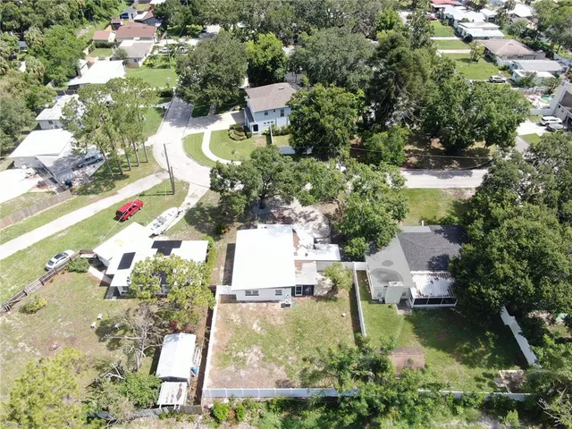 an aerial view of residential house with outdoor space and swimming pool