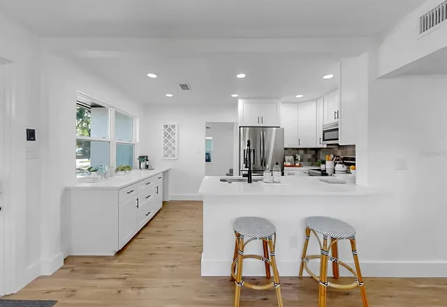 a kitchen with counter space cabinets and appliances