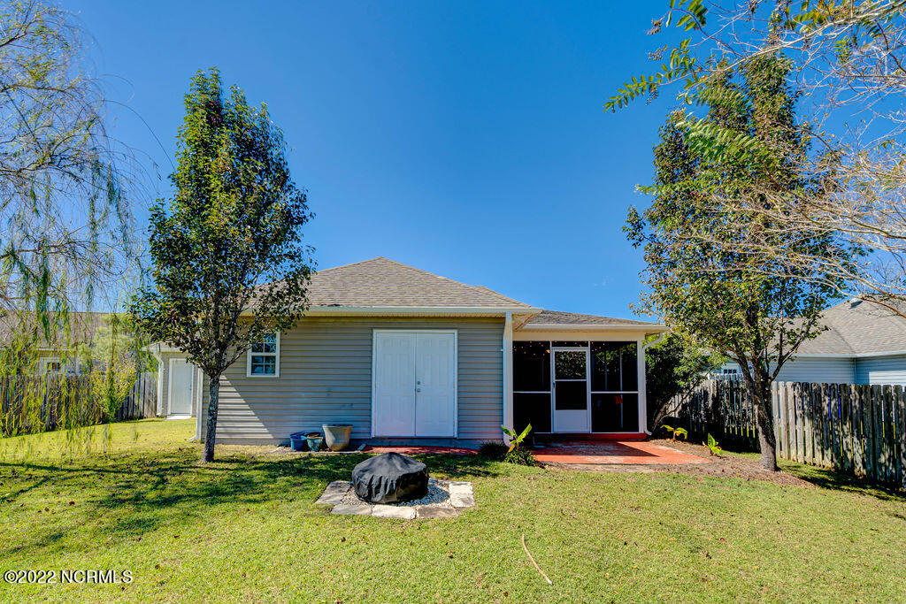 136 Watersfield Road Leland, NC 28451 - Photo 41 of 45 Back of house with storage area