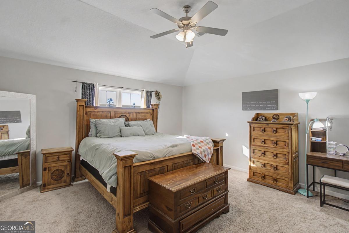 263 Brandonwood Road Northeast Ludowici, GA 31316 - Photo 11 of 34 a bed room with a bed and a television