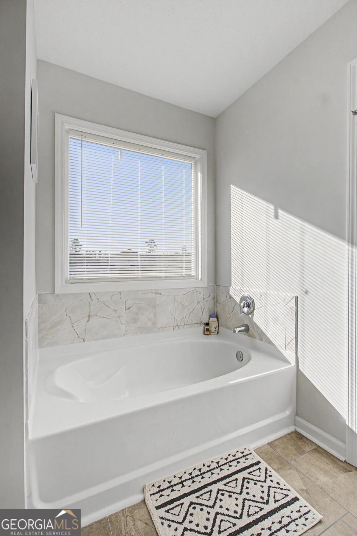 263 Brandonwood Road Northeast Ludowici, GA 31316 - Photo 15 of 34 a bathroom with a bathtub and a shower
