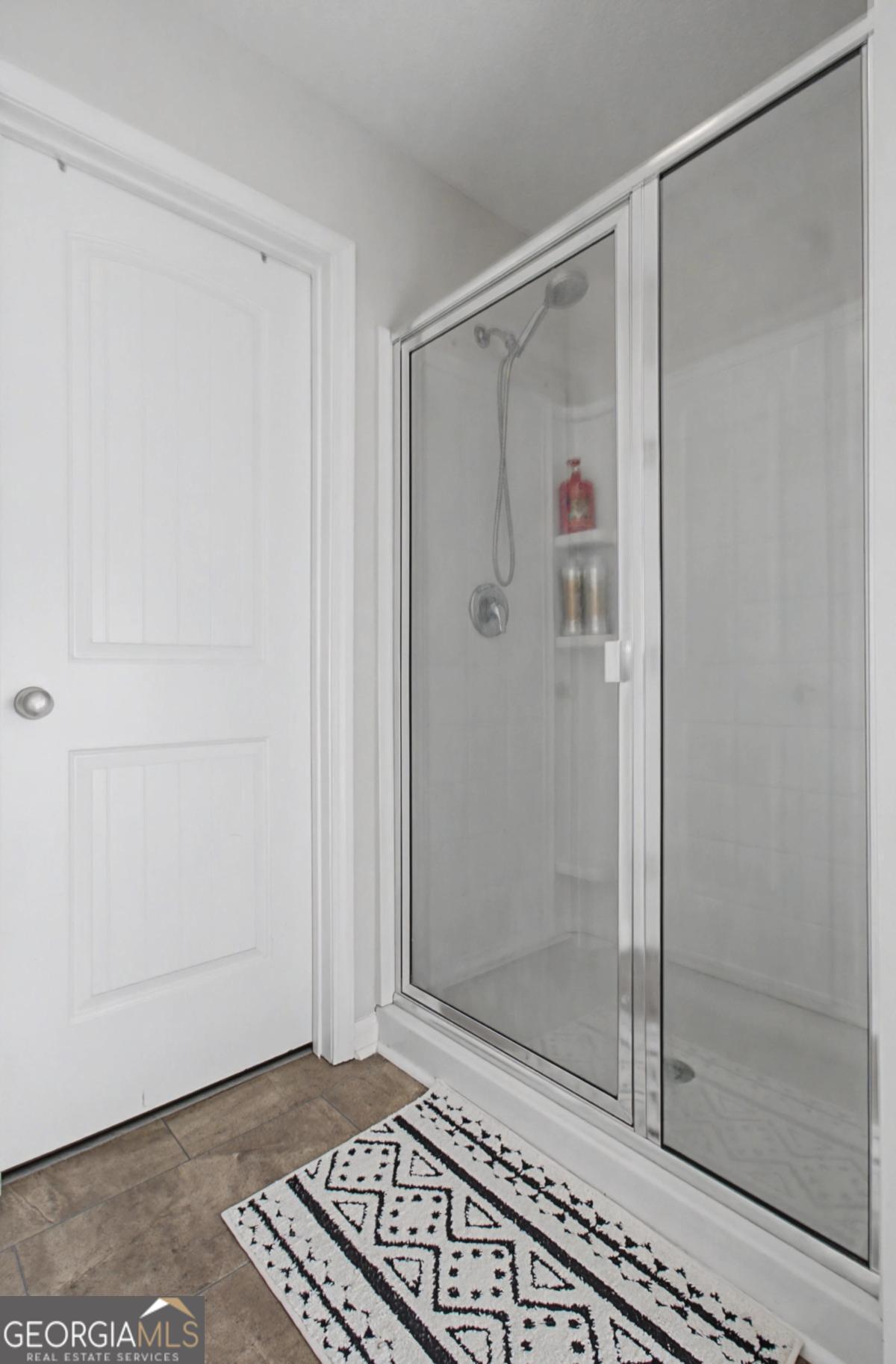 263 Brandonwood Road Northeast Ludowici, GA 31316 - Photo 16 of 34 a bathroom with a glass shower door