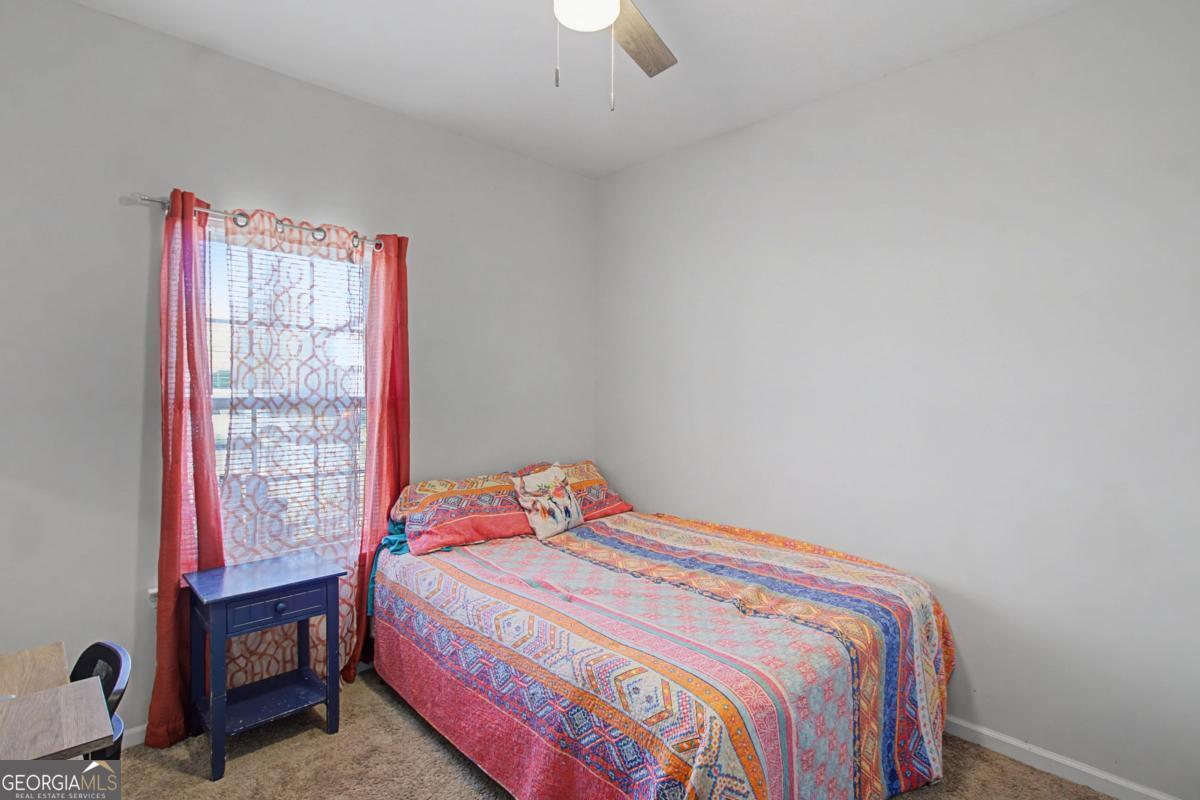 263 Brandonwood Road Northeast Ludowici, GA 31316 - Photo 17 of 34 a bedroom with a bed and a window