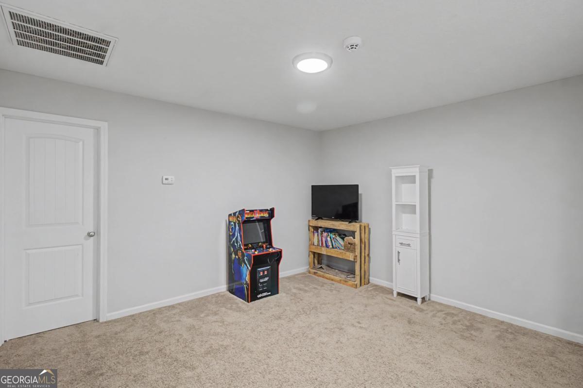 263 Brandonwood Road Northeast Ludowici, GA 31316 - Photo 30 of 34 a view of a livingroom with a flat screen tv