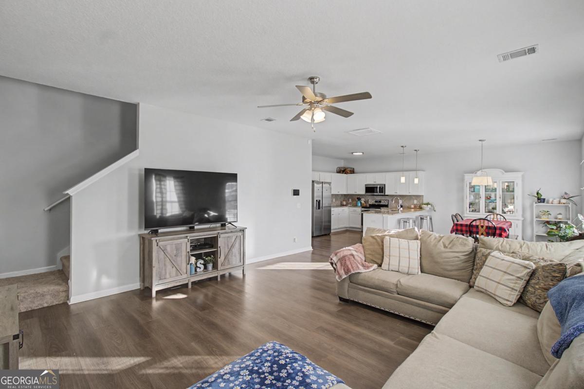 263 Brandonwood Road Northeast Ludowici, GA 31316 - Photo 7 of 34 a living room with furniture and a flat screen tv