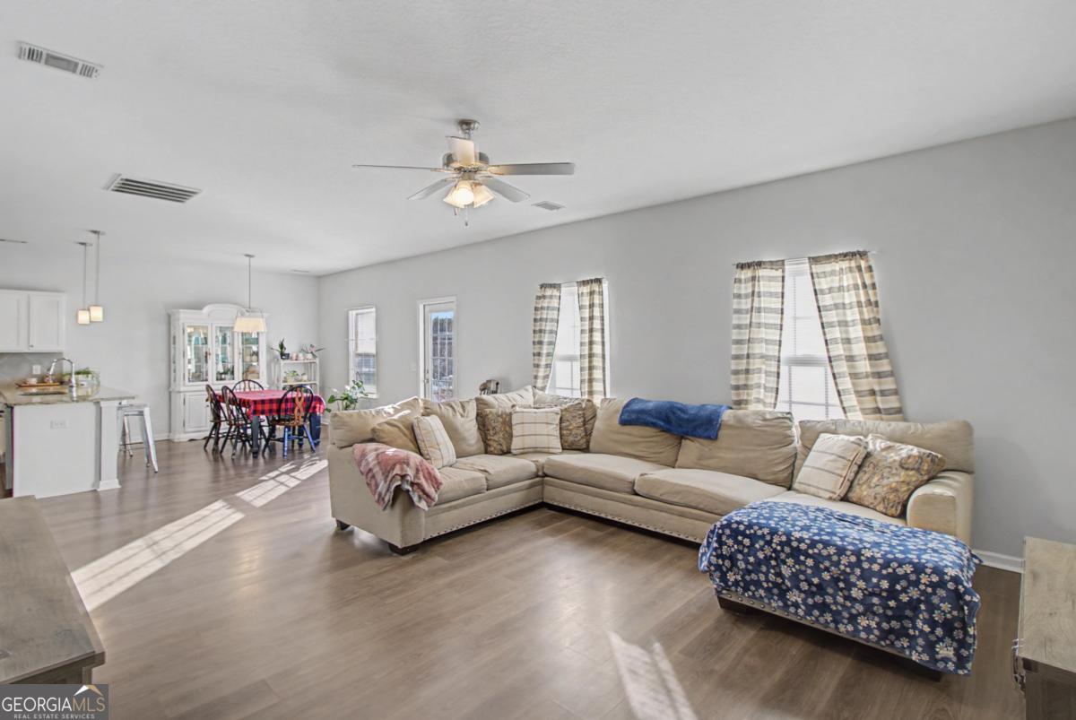 263 Brandonwood Road Northeast Ludowici, GA 31316 - Photo 8 of 34 a living room with furniture and a large window