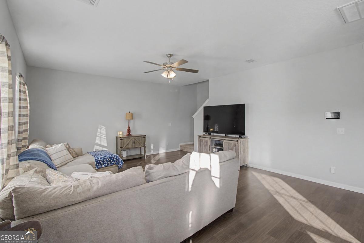 263 Brandonwood Road Northeast Ludowici, GA 31316 - Photo 9 of 34 a living room with furniture and a flat screen tv
