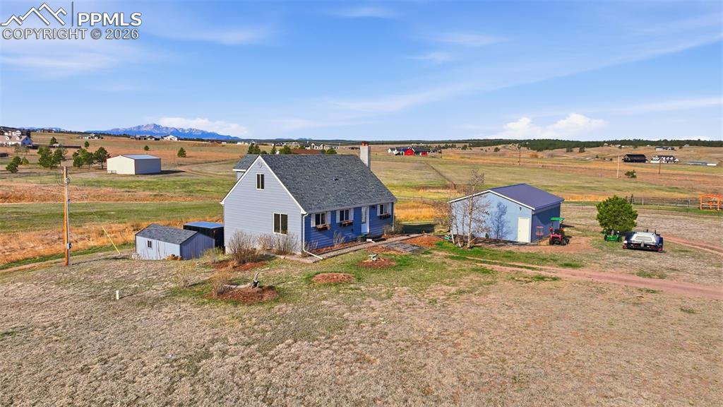 12285 Old Barn Road Elbert, CO 80106 - Photo 1 of 39 a view of a house with a ocean beach