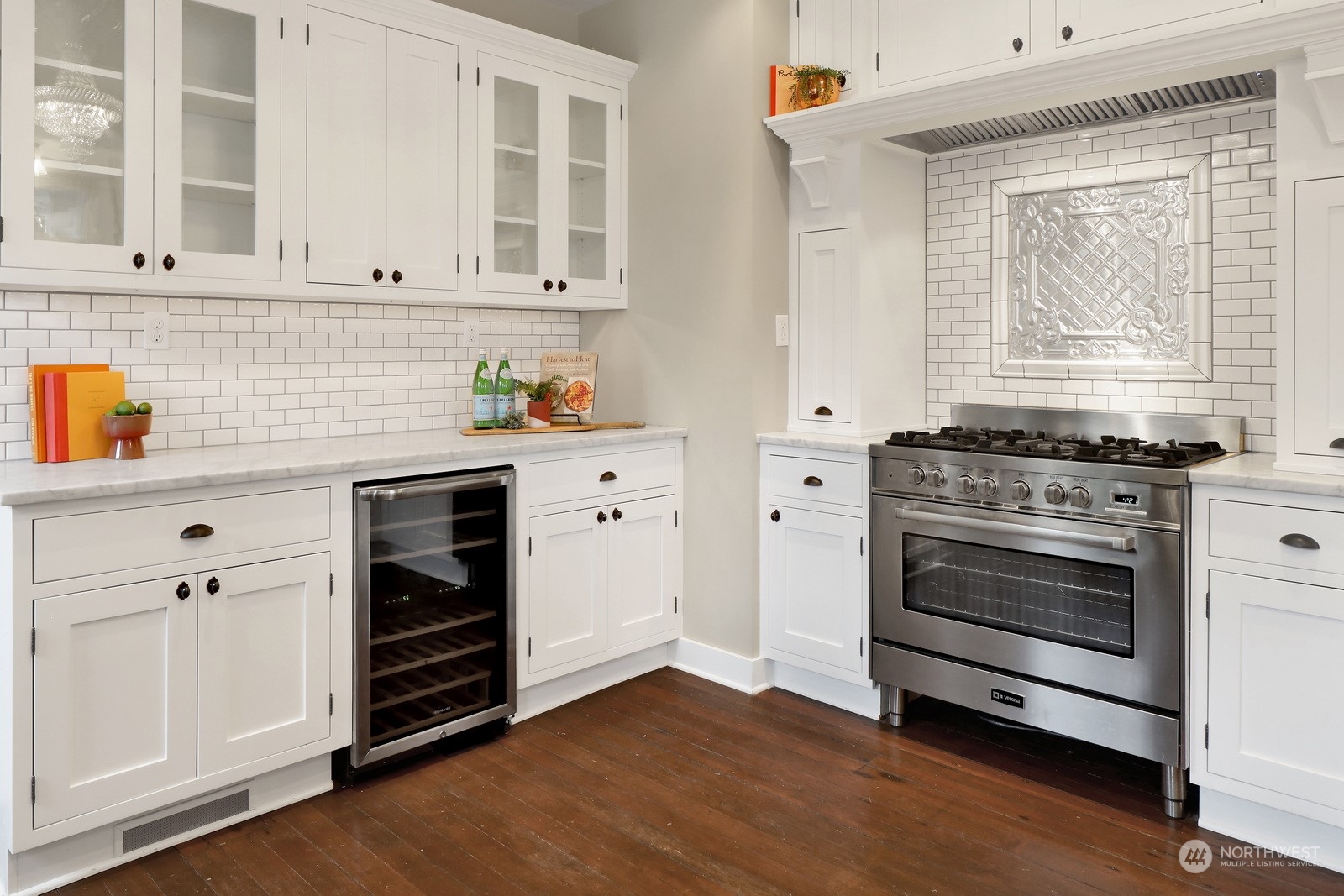2120 12th Street Anacortes, WA 98221 - Photo 11 of 40 a kitchen with granite countertop white cabinets and appliances