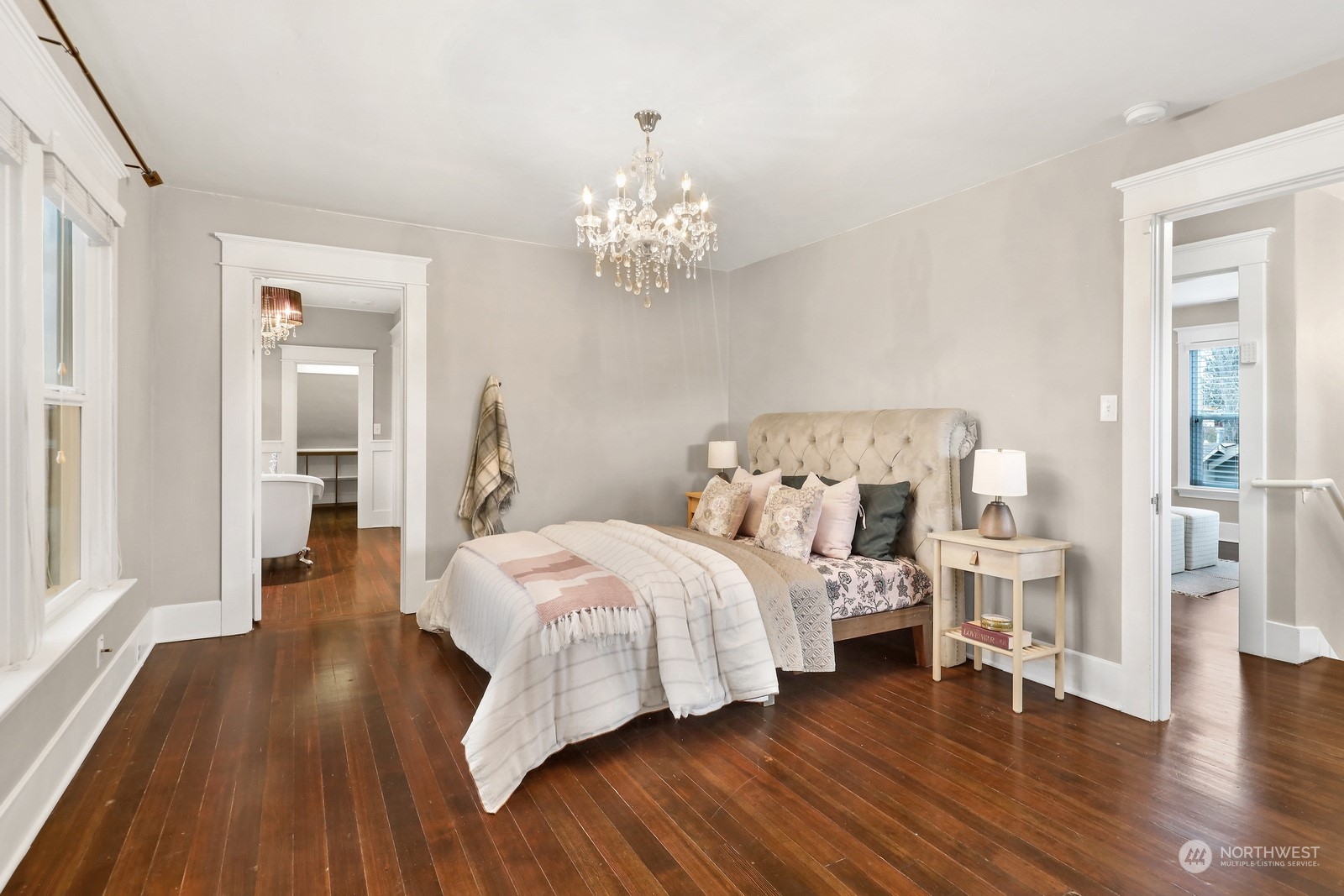 2120 12th Street Anacortes, WA 98221 - Photo 14 of 40 a bedroom with bed and a chandelier