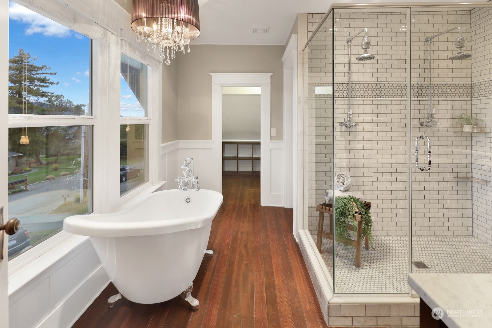 2120 12th Street Anacortes, WA 98221 - Photo 16 of 40 a white bath tub sitting next to a bathroom
