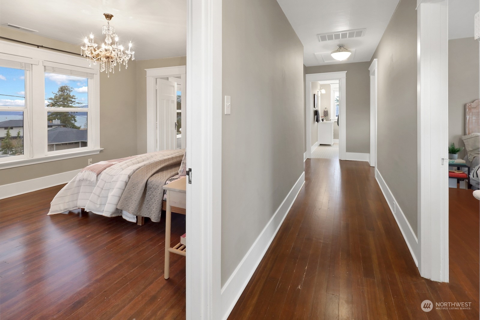2120 12th Street Anacortes, WA 98221 - Photo 29 of 40 a view of a bedroom with wooden floor and balcony