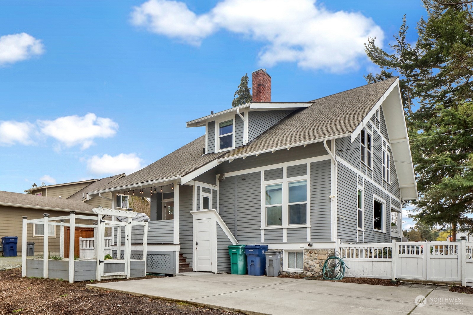 2120 12th Street Anacortes, WA 98221 - Photo 36 of 40 a front view of a house with a yard