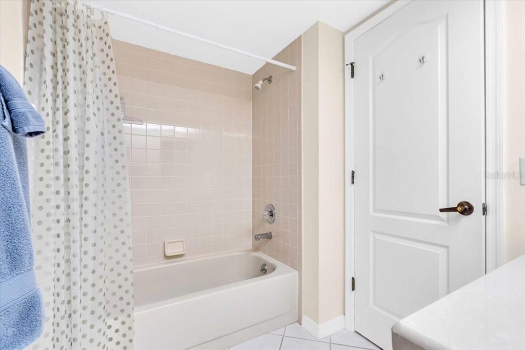 6505 Stone River Road, Unit 202 Bradenton, FL 34203 - Photo 15 of 55 a bathroom with a bathtub and a shower