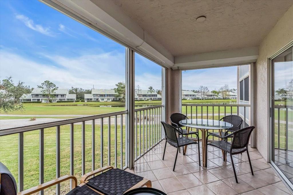 6505 Stone River Road, Unit 202 Bradenton, FL 34203 - Photo 29 of 55 a balcony with chairs