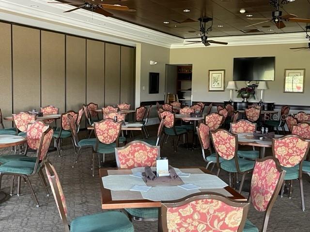6505 Stone River Road, Unit 202 Bradenton, FL 34203 - Photo 45 of 55 a living room with furniture and wooden floor