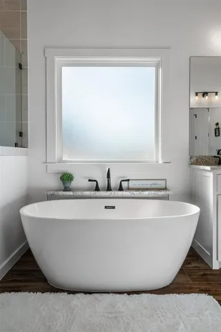 a white bath tub sitting in a bathroom