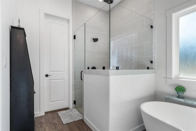 a bathroom with a shower and a toilet