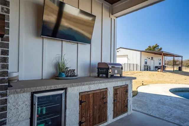a kitchen with stainless steel appliances granite countertop a sink and a stove