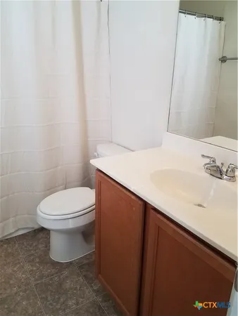 a view of a room that has a fan