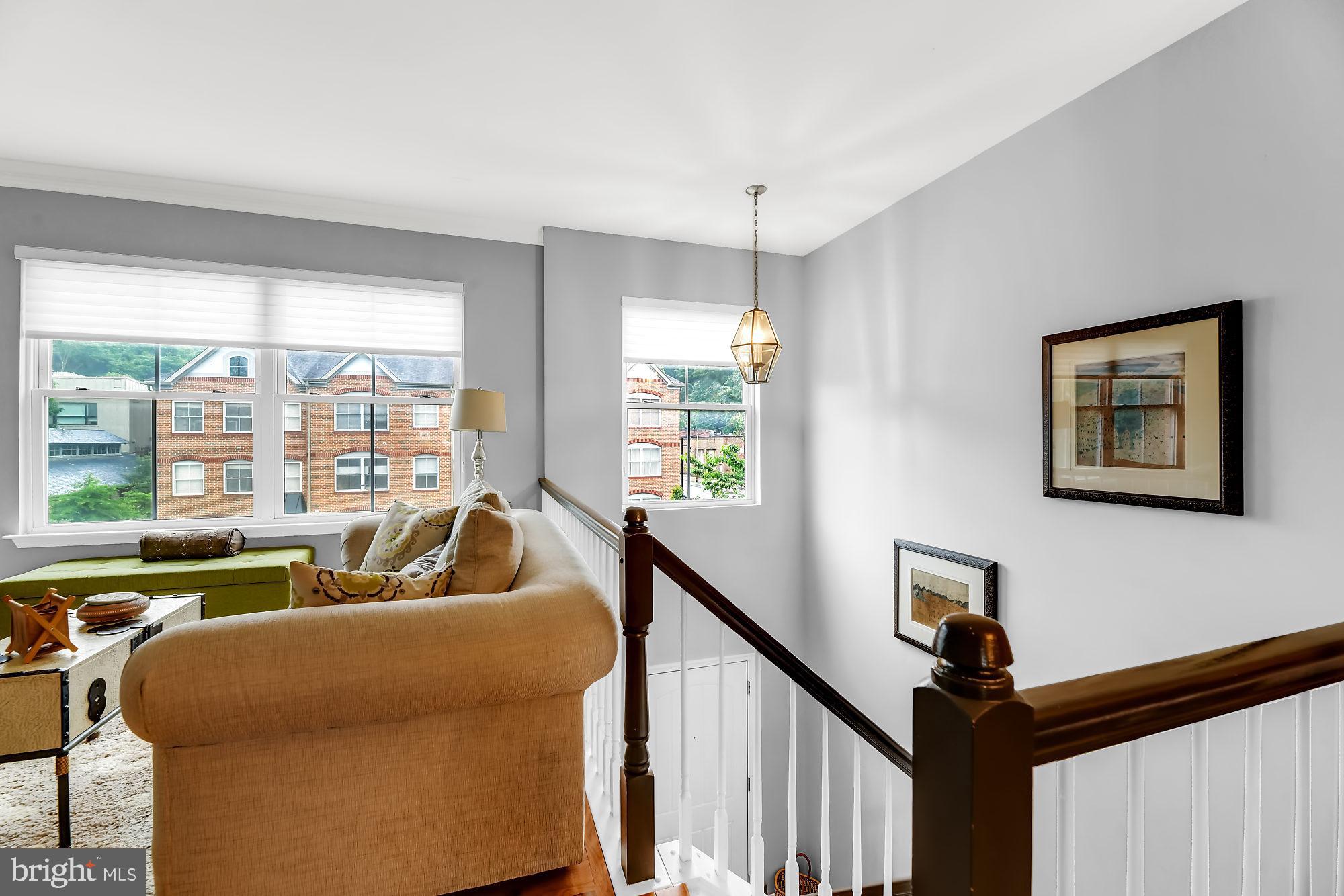 2090 Clipper Park Road Baltimore, MD 21211 - Photo 26 of 75 a living room with furniture and a large window
