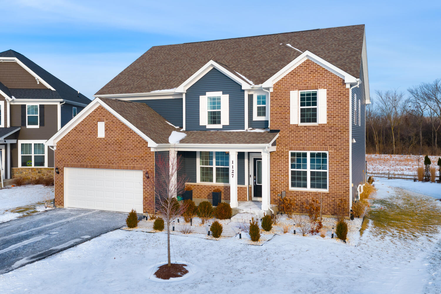 a front view of a house with a yard