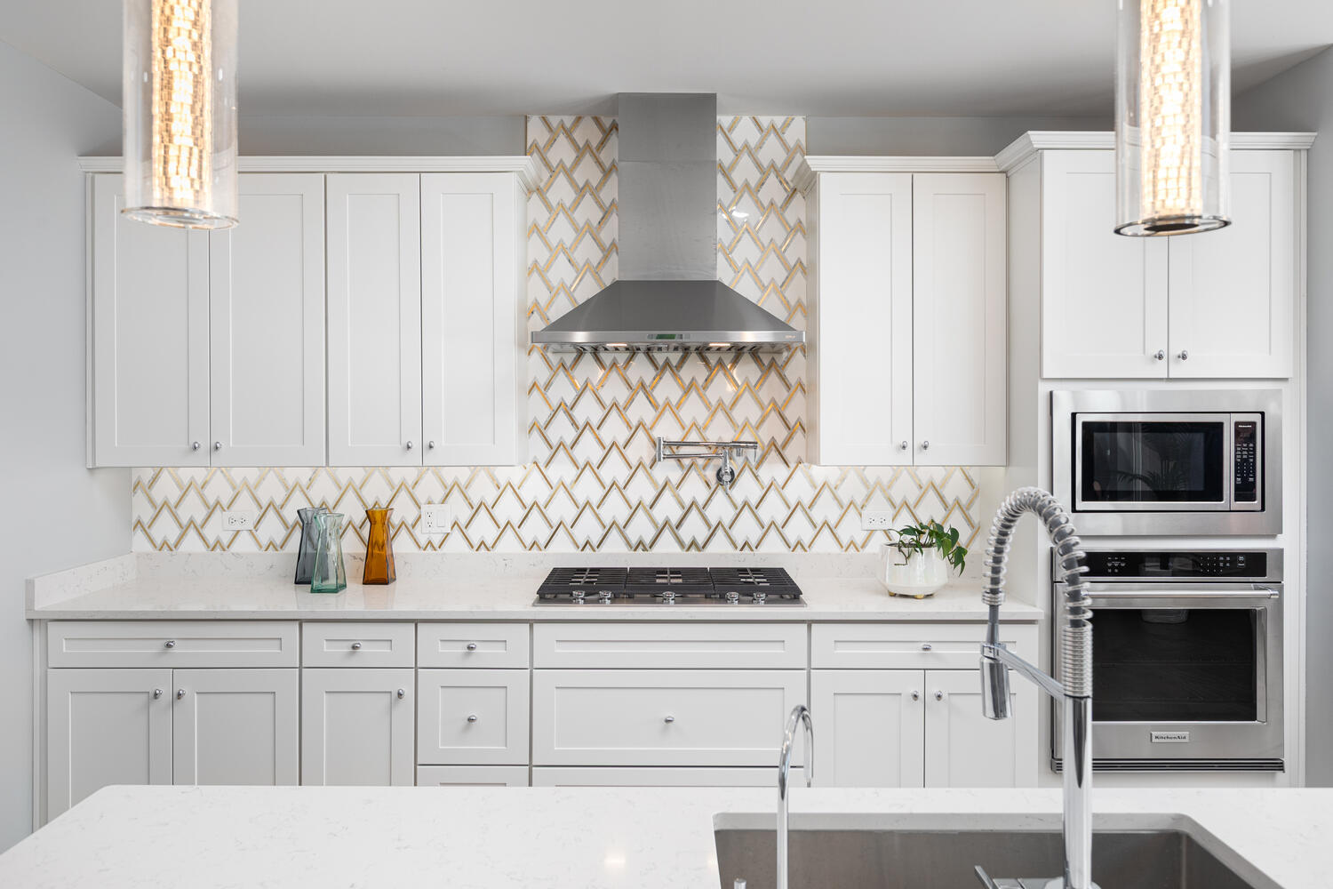 1127 Hibbard Road Naperville, IL 60563 - Photo 11 of 84 a kitchen with white cabinets and a stove