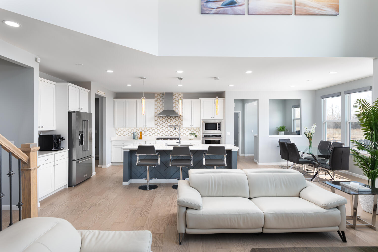 1127 Hibbard Road Naperville, IL 60563 - Photo 14 of 84 a living room with furniture a large window and a view of kitchen