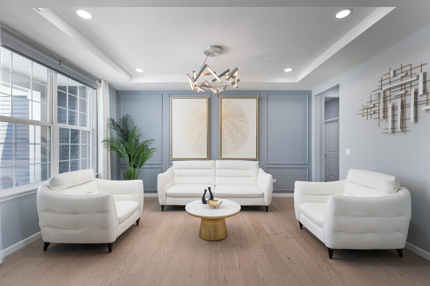 1127 Hibbard Road Naperville, IL 60563 - Photo 25 of 84 a living room with furniture and a potted plant