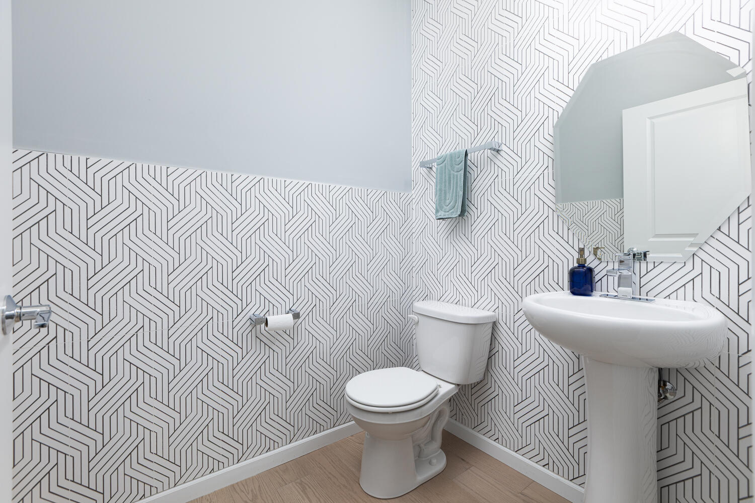 1127 Hibbard Road Naperville, IL 60563 - Photo 29 of 84 a white toilet sitting next to a bathroom sink and vanity