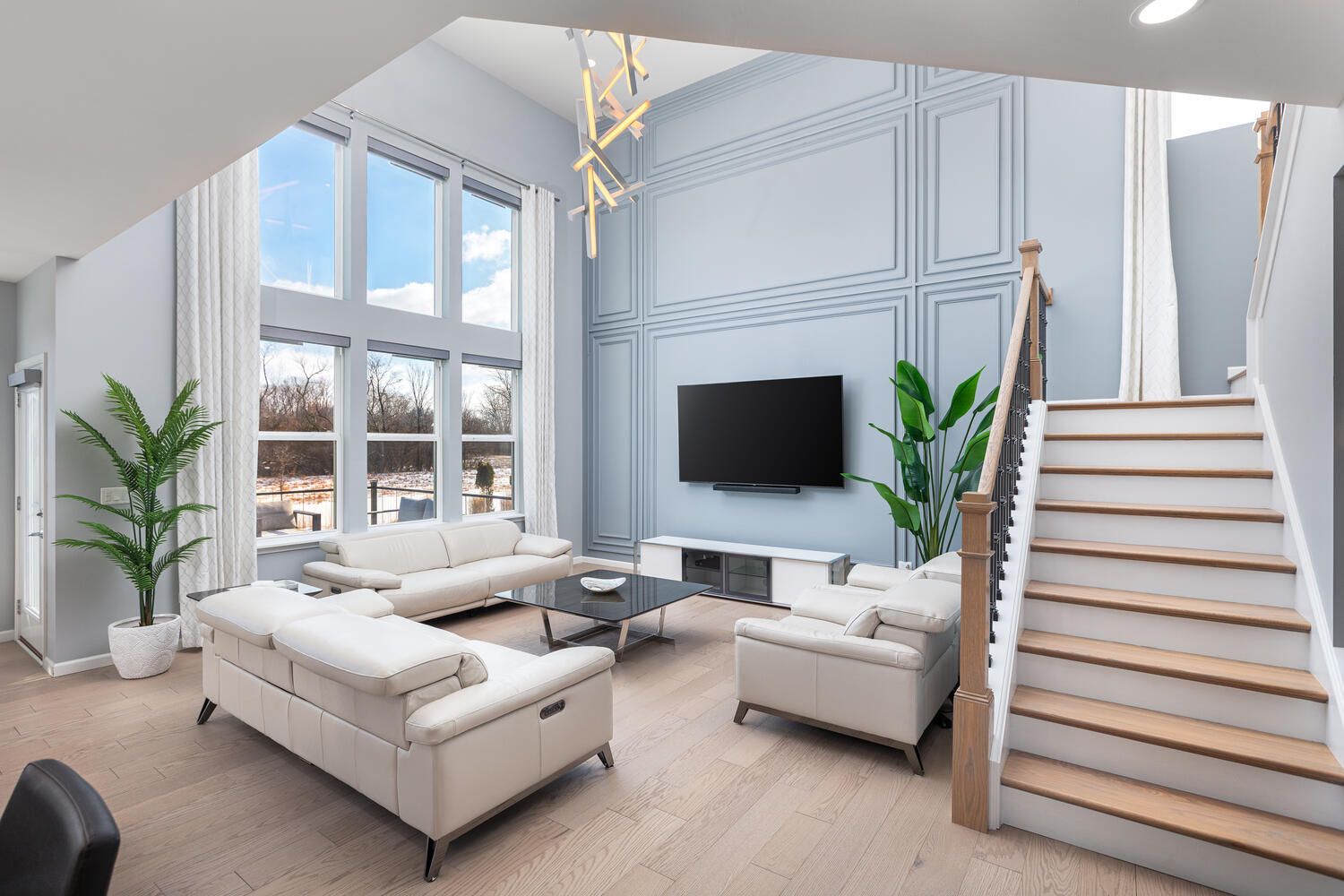 1127 Hibbard Road Naperville, IL 60563 - Photo 3 of 84 a living room with furniture and a flat screen tv