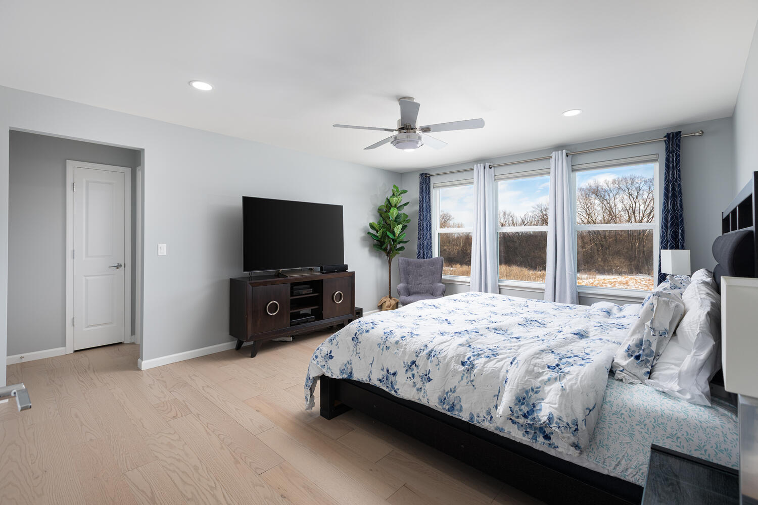 1127 Hibbard Road Naperville, IL 60563 - Photo 33 of 84 a bedroom with a bed and a flat screen tv