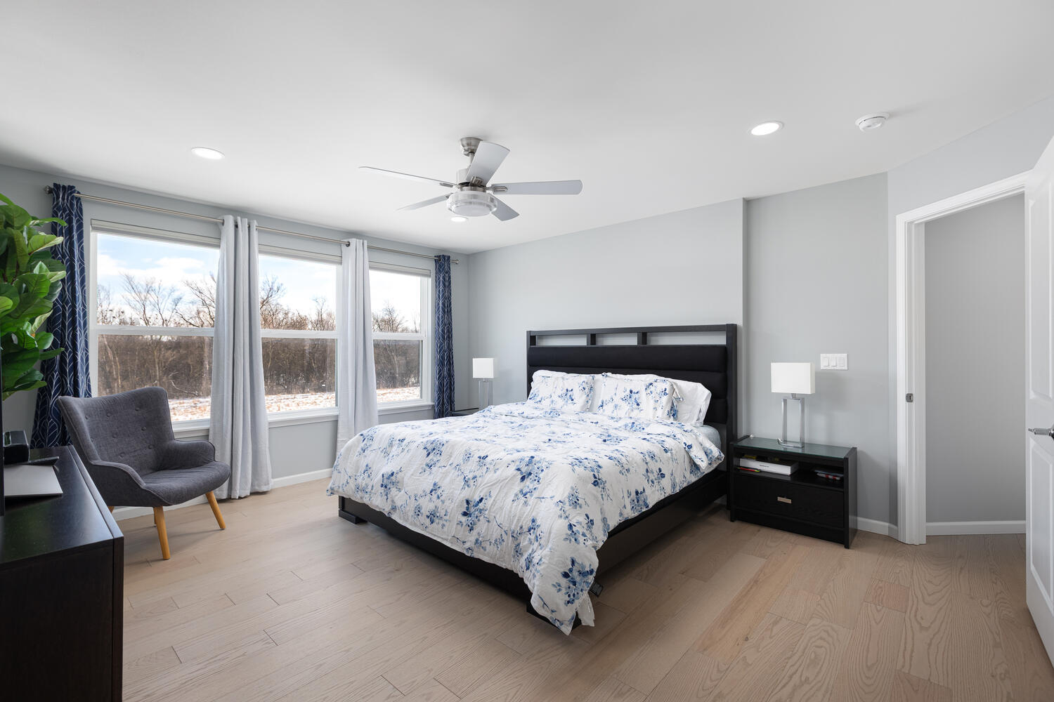 1127 Hibbard Road Naperville, IL 60563 - Photo 34 of 84 a bedroom with a large bed and a chandelier