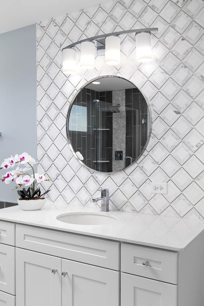 1127 Hibbard Road Naperville, IL 60563 - Photo 39 of 84 a bathroom with a sink and a mirror