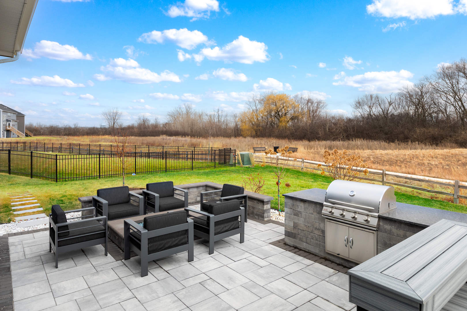 1127 Hibbard Road Naperville, IL 60563 - Photo 70 of 84 an outdoor sitting area with couch and chairs