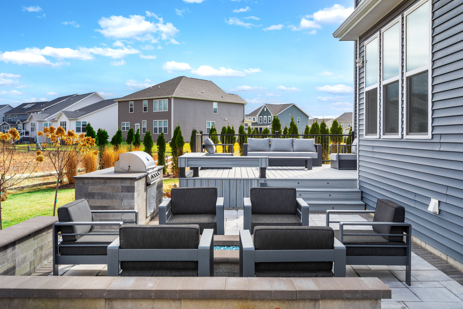 1127 Hibbard Road Naperville, IL 60563 - Photo 73 of 84 a view of a building with couches potted plants and a fireplace