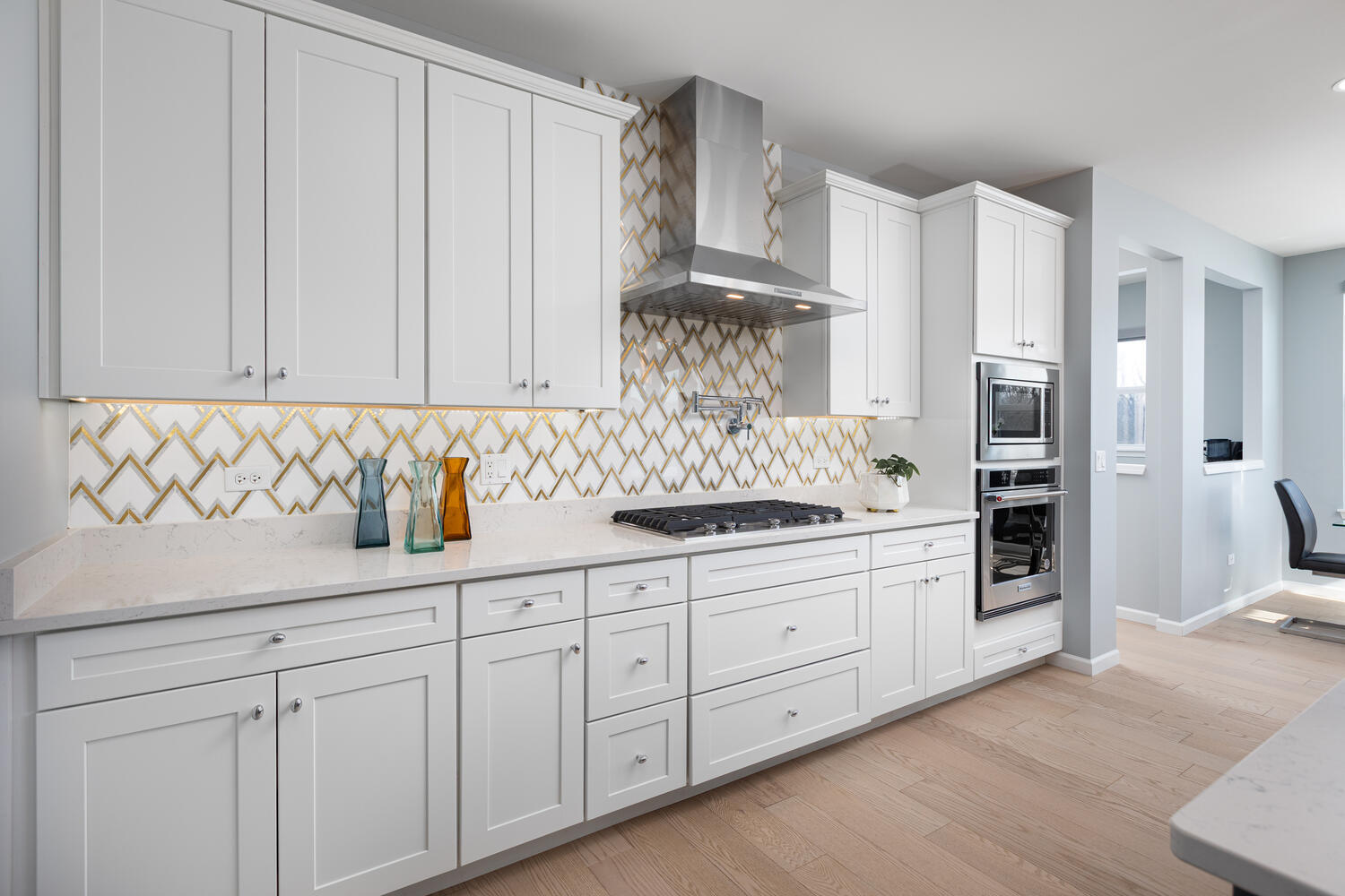 1127 Hibbard Road Naperville, IL 60563 - Photo 10 of 84 a kitchen with stainless steel appliances granite countertop a sink and a refrigerator